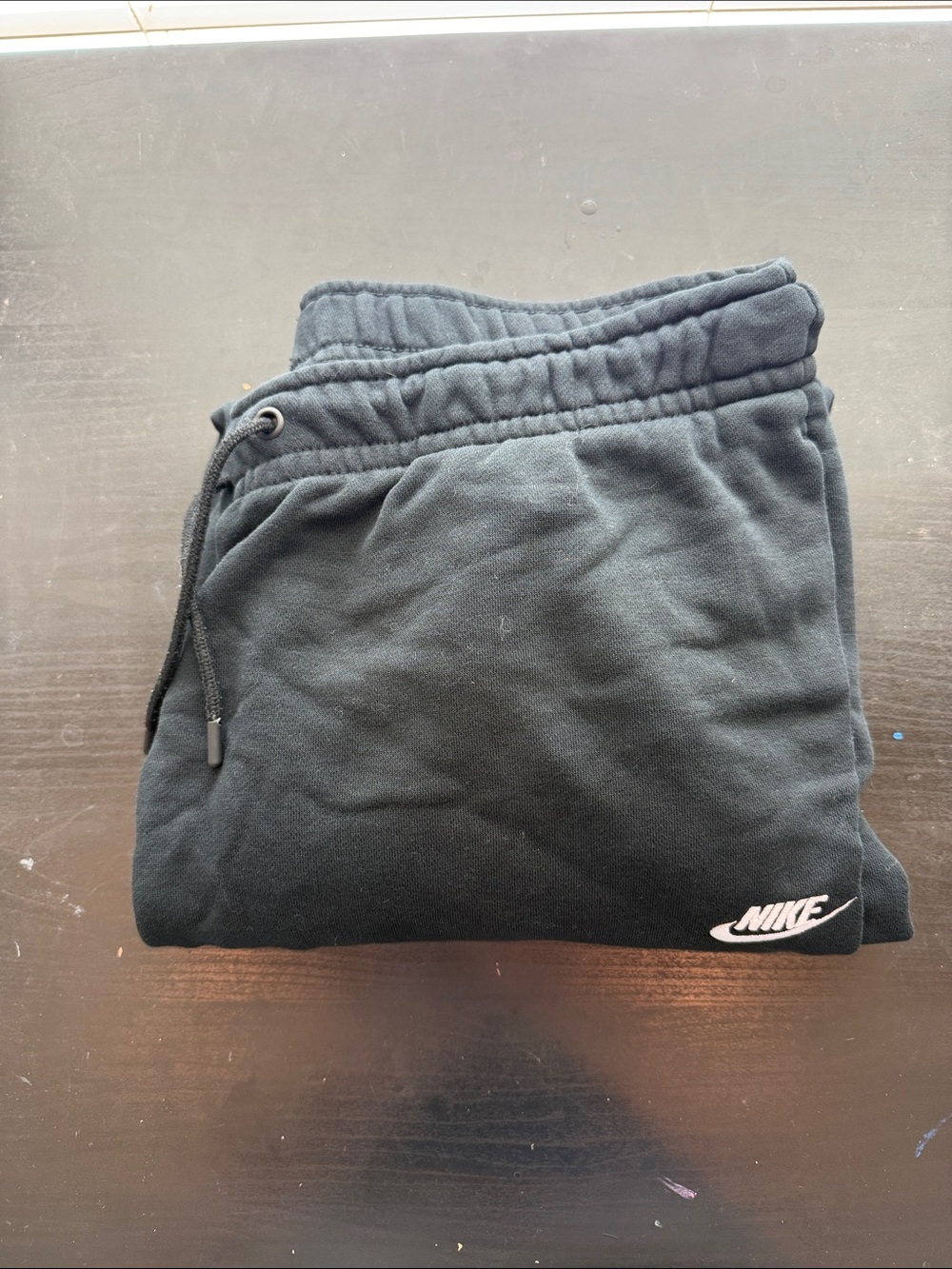 Nike woman’s Black Joggers with White Logo